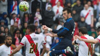 Gareth Bale heads in Real Madrid's first goal to begin the fight back against Rayo Vallecano. Curto De La Torre / AFP