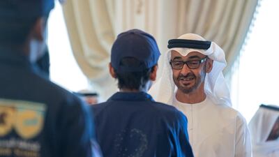 Sheikh Mohamed bin Zayed, Crown Prince of Abu Dhabi and Deputy Supreme Commander of the UAE Armed Forces, greets a member of the Ministry of Education 'Giving Ambassadors', during a Sea Palace barza. Mohamed Al Hammadi / Ministry of Presidential Affairs