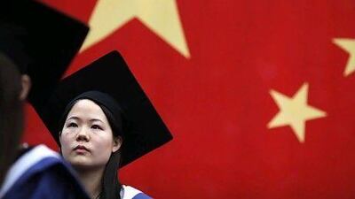 A student at her college graduation ceremony at Fudan University in Shanghai. University education is a key component of China's goal to create a broad urban tier of middle-class families.