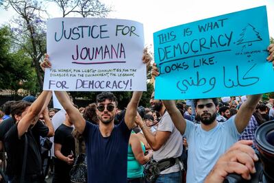 Supporters of Lebanese Joumana Haddad carry placards and shout slogans during a protest in front the Interior Ministry in Beirut on May 7. Nabil Mounzer / EPA