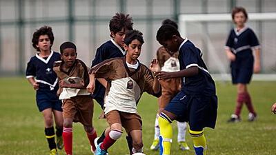 Al Muna Primary School, in brown, face Pearl Primary School at Al Jazira.