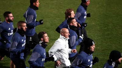 Cristiano Ronaldo and his Real Madrid teammates warm up during a training session in Yokohama near Tokyo on Monday, December 12, 2016. Behrouz Mehri / AFP