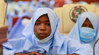 Girls who were kidnapped from a boarding school in the northwest Nigerian state of Zamfara, look on after their release in Zamfara, Nigeria. Reuters