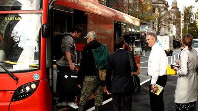 People board a bus as public transport returns to normal in Auckland, New Zealand. Getty Images