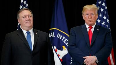 President Donald Trump stands with Secretary of State Mike Pompeo during a swearing-in ceremony for incoming Central Intelligence Agency director Gina Haspel at CIA Headquarters, Monday, May 21, 2018, in Langley, Va. Evan Vucci / AP Photo