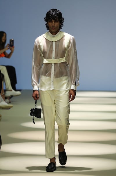 A model presents a creation from the collection by Maison Du Mec during the Men's Arab Fashion Week in Dubai in 2022. EPA / ALI HAIDER
