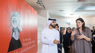 Sheikh Mansoor bin Mohammed bin Rashid Al Maktoum with Antonia Carver, the director of Art Dubai at the opening of the Sheikha Manal Young Artist Award