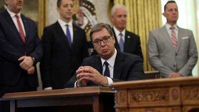 Serbia's President Aleksandar Vucic listens as US President Donald Trump speaks during a signing ceremony with Kosovo's Prime Minister Avdullah Hoti at the White House in Washington, September 4, 2020. Reuters