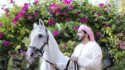 Horse owner and breeder Khalid Khalifa Al Naboodah with the stallion AF Maquam Alezz, at Al Aweer Stables, Dubai. All photos by Reem Mohammed / The National