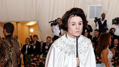 Ezra Miller's outfit was so theatrical it deserves a second mention. Here he arrives at the event in a silver cape and carrying a mask, as if attending a masquerade ball. Reuters