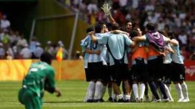 The Argentina players celebrate players celebrate after winning gold yesterday.