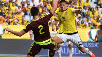 Venezuela's Wilker Angel, left, vies for the ball with Colombia's James Rodriguez during their South America 2018 World Cup qualifier in Barranquilla, Colombia on September 1, 2016. Colombia won the match 2-0. Luis Acosta / AFP