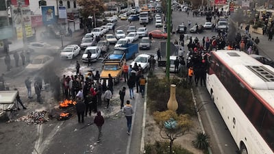 Protesters block the roads during a demonstration against petrol price hikes in Tehran in November 2019. Anadolu Agency