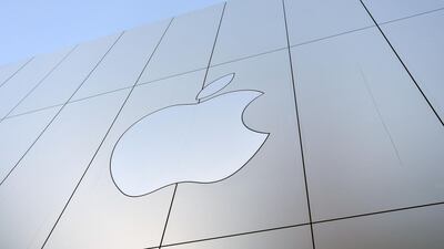 The Apple logo on the outside of an Apple store in San Francisco, California. The company has admitted it has been slowing older devices' performace. Josh Edelson / AFP