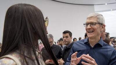 Tim Cook mingles with attendees. David Paul Morris / Bloomberg