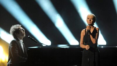 Ian Axel, left, of A Great Big World performs on stage with Christina Aguilera at the American Music Awards at the Nokia Theatre in Los Angeles. John Shearer / Invision / AP