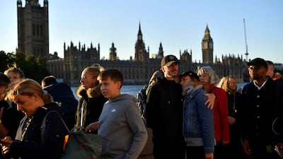 People queue to pay their respects to Britain's Queen Elizabeth, following her death, as she lies in state in Westminster Hall in London. Reuters / Clodagh Kilcoyne