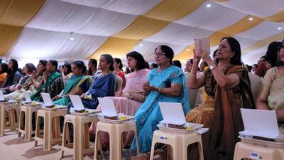 People attend the foundation stone laying ceremony.