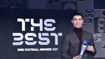 Portuguese striker Cristiano Ronaldo receives the FIFA Special Best Men Award 2021 for breaking the international goals scored record. AFP