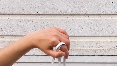 A Bottega Veneta Mini Pouch bag made using a Supreme shopping bag