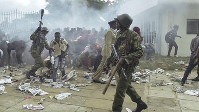 Kenyan police intervene during a stampede outside the Kasarani stadium as supporters of Kenya's president try to get into the venue to attend his inauguration ceremony on November 28, 2017. Simon Maina / AFP