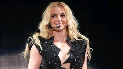 FILE - In this Sept. 27, 2011 file photo, singer Britney Spears performs on a stage during a concert in Kiev, Ukraine, during her European Femme Fatale Tour. A source says she is joining Simon Cowell's singing contest as a judge on the singing competition series "The X-Factor." (AP Photo/Leonid Naidiouk, file) *** Local Caption *** TV X Factor Spears.JPEG-0a0f3.jpg