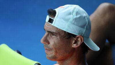 Rafael Nadal take a rest during practice at Melbourne Park. Reuters