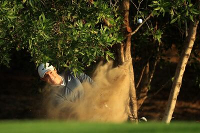 Rory McIlroy found a bunker on his first hole. Andrew Redington / Getty Images