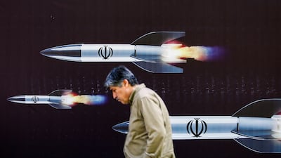 A banner depicting missiles on a street in Tehran. Iran's heavy missile attack on Israel has been met with a response of attack drones used against a military factory. AFP