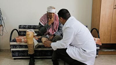 Ibrahim Zeid, 65, a Palestinian cigarette vendor and a diabetic, sits next to his artificial limb as he receives treatment at a prosthetics centre in Qalqilya. Ammar Awad / Reuters