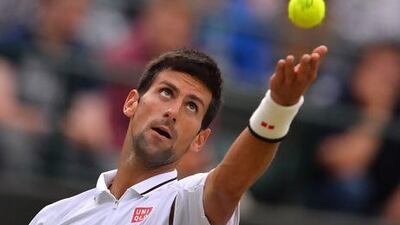 Serbia's Novak Djokovic serves against Czech Republic's Tomas Berdych.