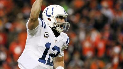 Andrew Luck celebrates a touchdown pass during the Indianapolis Colts' NFL play-offs win over the Denver Broncos on Sunday. Joe Mahoney / AP / January 11, 2015