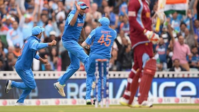 LONDON, ENGLAND - JUNE 11: Ravichandran Ashwin of India celebrates with Rohit Sharma after taking the catch to dismiss Chris Gayle of the West Indies during the ICC Champions Trophy Group B match between India and West Indies at The Kia Oval on June 11, 2013 in London, England. (Photo by Mike Hewitt/Getty Images) *** Local Caption *** 170322368.jpg