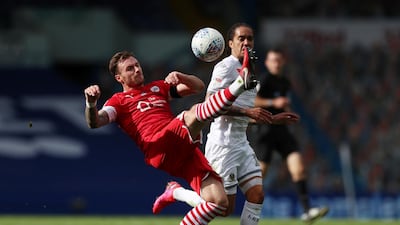 Leeds United's Helder Costa in action with Barnsley's Michael Sollbauer. Reuters