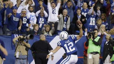 Andrew Luck threw for three touchdowns and ran for another against Denver on Sunday. Michael Conroy / AP