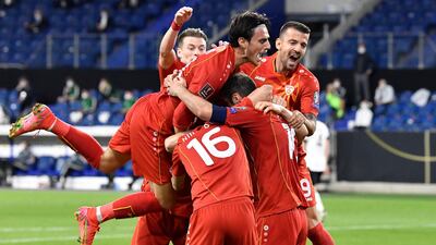 North Macedonia's Goran Pandev (r) and teammate celebrate taking the lead. AP