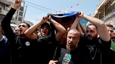 Mourners carry the body of Mahmoud Abu Sa'an, a Palestinian who was killed in an Israeli raid in the Israeli-occupied West Bank. Reuters