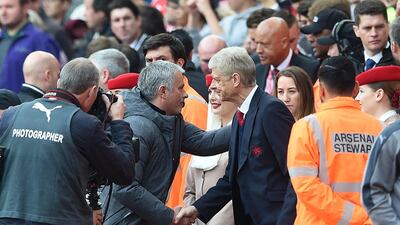 Jose Mourinho, left, has an improved relationship with Arsene Wenger, right, in recent years. Facundo Arrizabalaga / EPA