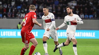 Portugal`s Cristiano Ronaldo, centre, and Bernardo Silva, right, in action against Luxembourg`s Laurent Jans. EPA