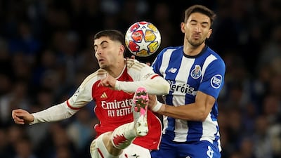 Arsenal forward Kai Havertz fights for the ball with Porto midfielder Marko Grujic. EPA
