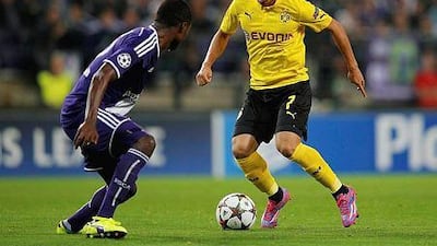 Shinji Kagawa, right, of Borussia Dortmund takes on Chancel Mbemba of Anderlecht during the Uefa Champions League Group D match against RSC Anderlecht at Constant Vanden Stock Stadium on October 1, 2014 in Anderlecht, Belgium. Dean Mouhtaropoulos/Getty Images
