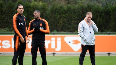 Virgil van Dijk, left Georginio Wijnaldum and Netherlands manager Ronald Koeman during a training session. Reuters