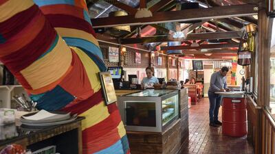 There are with four separate dining spaces to choose from at The Art House Cafe. Khushnum Bhandari / The National