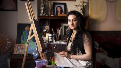 The artist Shaok Sabah Tahir working in her home studio in Dubai. Antonie Robertson / The National