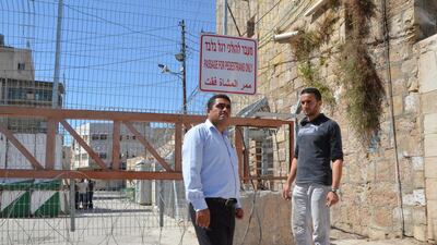 Hazem Abu Rajab, 28, whose family is being forced out of their home in Hebron by the Israeli army and settlers, with Badee Dwaik, leader of a non-government organisation Human Rights Defenders. Kate Shuttleworth for The National / August 15, 2015
