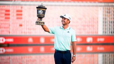 Xander Schauffele poses with the trophy after winning the WGC-HSBC Champions golf tournament in Shanghai. AFP