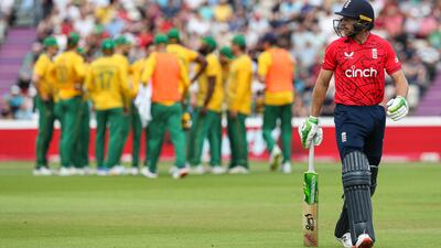 Jos Buttler walks off the field after being caught out by South Africa's Lungi Ngidi during the third T20 at the Ageas Bowl, Southampton. PA