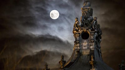 The moon rises over Vajdahunyad Castle in the City Park, Budapest, Hungary. Balazs Mohai / EPA