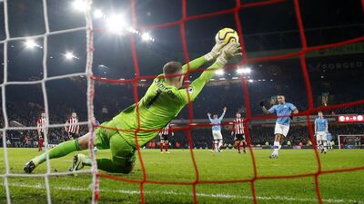 Sheffield United's Dean Henderson saves a penalty from Manchester City's Gabriel Jesus. Reuters