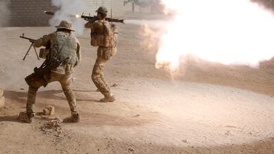 Iraqi special forces fire at ISIL fighters in Al Shura, south of Mosul, on October 29, 2016. Goran Tomasevic / Reuters